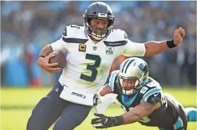  ?? BOB DONNAN/ USA TODAY SPORTS ?? Russell Wilson threw for 339 yards and 2 TDs in the Seahawks’ win at Carolina.