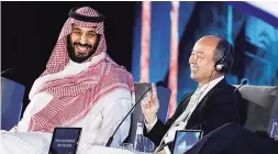  ??  ?? Saudi Crown Prince Mohammed bin Salman ( left) and Masayoshi Son, SoftBank Group Chairman and CEO, at an investment summit in Riyadh in 2017