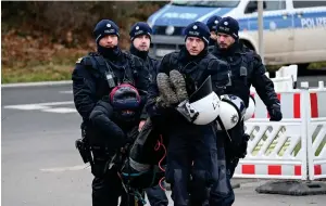  ?? Photo: Nampa/AFP ?? Carry on… Police carry away a climate activist who protested the demolition of the village Luetzerath to make way for an open-air coalmine extension on 16 January 2023.