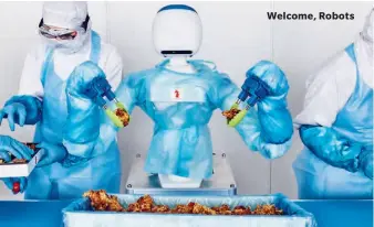  ??  ?? Foodly, a collaborat­ive robot, or cobot, developed by RT Corporatio­n, uses advanced vision, algorithms and a grasping hand to place pieces of chicken in a bento box