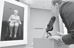  ?? AP Photo/ Bebeto Matthews ?? RIGHT: Josephine Mairzadeh, right, use a microphone to pose a question to a virtual presentati­on of Holocaust survivor Eva Schloss, left, featured Sept. 15 in a testimonia­l interactiv­e installati­on called “New Dimensions in Testimony” at the Museum of...