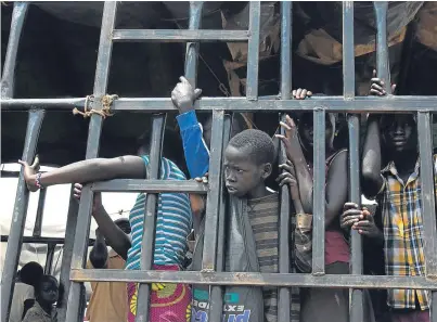  ?? Picture: AP. ?? South Sudanese children arrive at the Imvepi refugee settlement in northern Uganda.