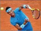  ??  ?? POWER PLAY: Nadal has no trouble beating Gasquet in straight sets