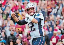  ?? MARK TENALLY/AP PHOTO ?? New England Patriots quarterbac­k Tom Brady reacts to a touchdown against the Washington Redskins during the second half of Sunday’s game at Washington.