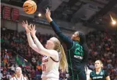  ?? RYAN HUNT/GETTY ?? Virginia Tech’s Matilda Ekh, left, battles Marshall’s Mahogany Matthews for a rebound during a first-round NCAA Tournament game Friday in Blacksburg.