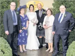  ??  ?? Proud parents Jim and Ann Main, the bride and groom and Janet and Ian Hay