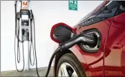  ?? RICHARD VOGEL / AP ?? Ohio’s current up-front registrati­on fees for hybrid and electric vehicles are among the highest in the nation, slowing the adoption of these vehicles.