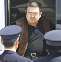  ??  ?? IN THIS FILE PHOTO, North Korean heir-apparent Kim Jong Nam emerges from a bus as he is escorted by Japanese authoritie­s upon his deportatio­n from Japan at Tokyo’s Narita internatio­nal airport May 4.