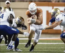  ?? RICARDO B. BRAZZIELL / AMERICAN-STATESMAN ?? The Longhorns may go as far against the Trojans on Saturday night as sophomore quarterbac­k Sam Ehlinger can take them. Ehlinger appears improved in the pocket this season and less likely to run, but USC’s defense held Stanford to 17 points last week in a loss.