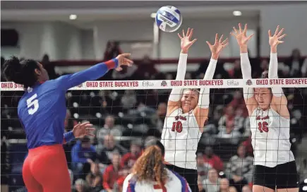  ?? ADAM CAIRNS/COLUMBUS DISPATCH ?? Mac Podraza (10) and Adria Powell (16), here blocking Tennessee State’s Celestial Miller during the NCAA tournament, are two of the Ohio State women’s volleyball players who entered the transfer portal after the Buckeyes’ Elite Eight season.