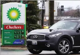  ?? THE ASSOCIATED PRESS ?? Gas prices are displayed at a BP gas station in Elgin, Ill., earlier this year.