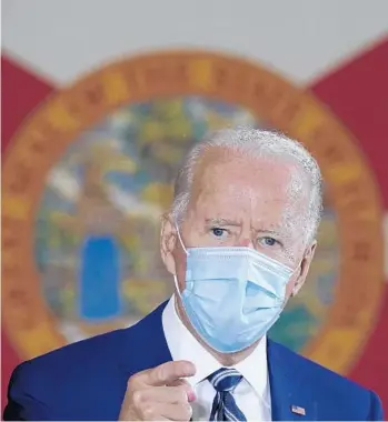  ?? CAROLYNKAS­TER/AP ?? The Florida state flag hangs behindDemo­cratic presidenti­al candidateJ­oeBiden as he speaksOct. 13 at Southwest Focal Point Community Center inPembroke­Pines.