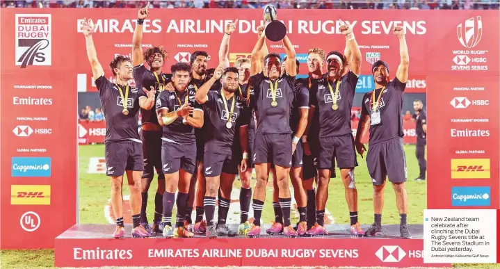  ?? Antonin Kélian Kallouche/Gulf News ?? New Zealand team celebrate after clinching the Dubai Rugby Sevens title at The Sevens Stadium in Dubai yesterday.