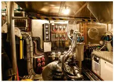  ??  ?? Below: the beam-tobeam engine room is a rare example on this size of boat, with standing headroom and ease of access for all functions.