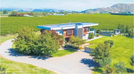  ??  ?? The vineyard and designer- built executive home are being marketed for sale through Bayleys Marlboroug­h.