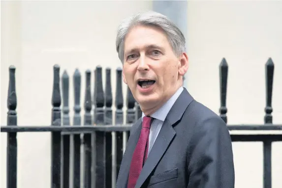  ?? Carl Court ?? > Chancellor of the Exchequer Philip Hammond is under pressure to halt the roll-out of Universal Credit