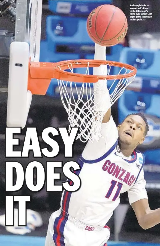  ?? AP ?? Joel Ayayi dunks in second half of topranked Gonzaga’s romp over USC in Elite Eight game Tuesday in Indianapol­is.