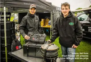  ??  ?? Johnny Nel from Front Runner UK presents Jason Milligan with his prize