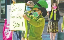  ?? GAVIN YOUNG ?? Ctrain Green Line supporters rallied outside city hall early this month. Council is expected to discuss the line Tuesday.