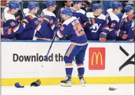  ?? John Minchillo / Associated Press ?? New York Islanders center Brock Nelson (29) celebrates at the bench after scoring a hat-trick in the third period against the Dallas Stars on Saturday.