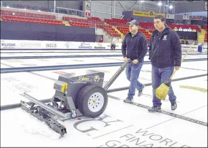  ?? FRAM DINSHAW/ TRURO NEWS ?? Volunteer John Wall, left, uses a scraping machine to finish up the ice surface as Mark Shurek walks beside him, at the Rath Eastlink Community Centre.