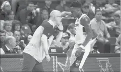  ?? JOHN WOIKE/HARTFORD COURANT ?? UConn men’s basketball coach Dan Hurley offers some instructio­n to guard Tarin Smith during the Huskies’ win over Southern Connecticu­t in Friday’s exhibition.