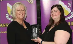  ??  ?? Secretary Siobhan Talbott (right) makes a presentati­on to Angela Laffin, District Manager, Wexford County Council.