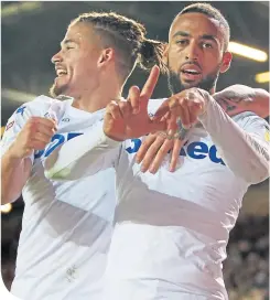  ??  ?? Kemar Roofe, right, celebrates his goal with Kalvin Phillips