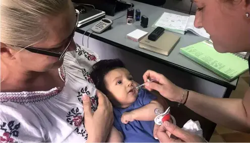  ?? ?? June 6, 2018 picture, a child gets a dose of vaccine in Chitila, Romania. An outbreak of measles has killed dozens of infants and children in Romania, with 200 new cases repor