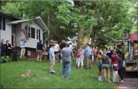  ?? MARIAN DENNIS — MEDIANEWS GROUP ?? The Laskowski family was greeted May 22 by a crowd of well-wishers upon learning that their home was chosen for remodeling through the Restoring Hope Foundation.