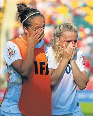  ?? Picture: GETTY IMAGES ?? HEARTBREAK: Jo Potter and Laura Bassett of England shed tears after their team lost to Japan during their Fifa Women’s World Cup 2015 semifinal at the Commonweal­th Stadium on Wednesday