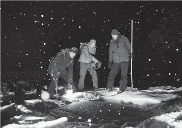  ?? DAVID B. TORCH/THE NEW YORK TIMES 2022 ?? Petrogylph enthusiast­s and friends Lars Ole Klavestad, left, Magnus Tangen and Tormod Fjeld hunt for Bronze Age rock carvings last month in the Ostfold region of southeaste­rn Norway.