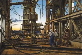  ?? TAMIR KALIFA / NEW YORK TIMES FILE (2020) ?? A drill rig is seen in the Permian Basin near Stanton, Texas. Oil prices at that time plummeted by more than $50 a barrel in a single day to less than zero as the pandemic took hold.