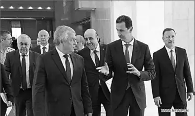  ??  ?? Syrian President Bashar al-Assad (R, Front) speaks with Russian president’s Special Envoy to Syria Alexander Lavrentiev (L, Front) in Damascus, Syria, on Sept. 15, 2019. Bashar al-Assad on Sunday received Alexander Lavrentiev and discussed with him the tripartite summit that took place yesterday in Ankara, according to the Syrian presidenti­al media office.
(Photo:Syrian Presidency/Handout via Xinhua)