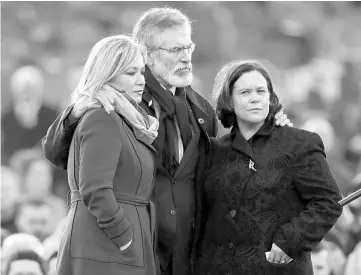  ??  ?? Sinn Fein’s Michelle O’Neill, Gerry Adams and Mary Lou McDonald join mourners at Martin McGuinness’s funeral in Londonderr­y, Northern Ireland last Tuesday. — Reutes photo