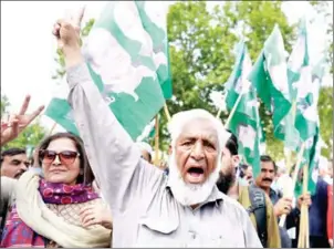  ?? AAMIR QURESHI/AFP ?? Supporters of the ruling party Pakistan Muslim League-Nawaz celebrate after a Supreme Court verdict on the Panama Papers in Islamabad yesterday.