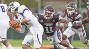  ?? KEITH WARREN, ASSOCIATED PRESS ?? Mississipp­i State's Jaquarius Landrews (11) wraps up Stephen F. Austin's Josh Covey (11). Landrews got the first start of his Mississipp­i State career against Auburn on Oct. 6.