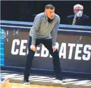  ?? AP PHOTO/JEFF ROBERSON ?? Porter Moser coaches the Loyola University Chicago men’s basketball team in a Sweet 16 game against Oregon State on March 27 at Bankers Life Fieldhouse in Indianapol­is.