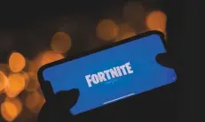  ?? AFP ?? A person logging into Epic Games’ Fortnite. Epic Games said it will appeal a ruling that loosened Apple’s control over App Store payments.