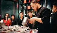  ?? PHOTOS PROVIDED TO CHINA DAILY ?? Left: Steamed mandarin fish with soy sprouts and soy sauce, paired with osmanthus gel. Right: Paolo Belloni, head chef of the Beijing social lounge Equis, prepares a cocktail dinner.