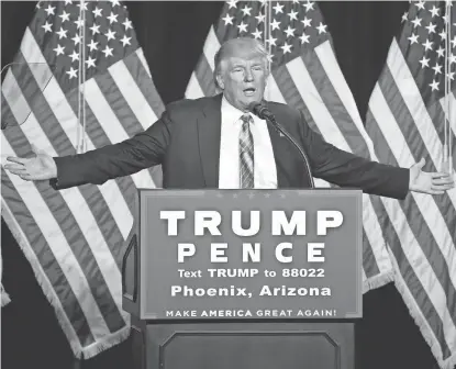  ?? MICHAEL CHOW/THE REPUBLIC ?? Then-Republican presidenti­al candidate Donald Trump speaks to a crowd at the Phoenix Convention Center a year ago.