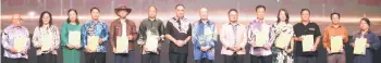  ?? ?? Hajiji (seventh from right) and Sabah Foundation Group director Datuk Ghulam Haidar Khan Bahadar (seventh from left) with the recipients of the ‘Jasamu DiKenang’ award.