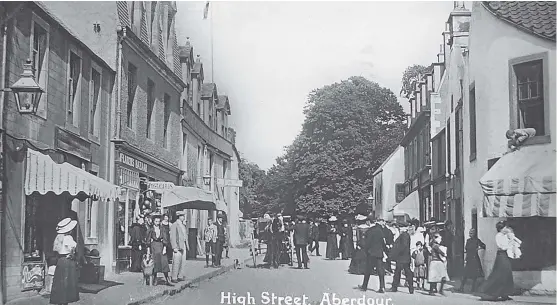  ??  ?? A view of Aberdour High Street in the early 1900s. There are so many people in the picture they may have sailed over from Portobello as this was a popular destinatio­n for Edinburgh residents.If you have a story for Craigie email: craigie@ thecourier.co.uk