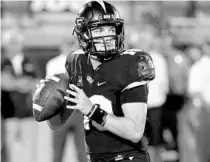  ?? JOHN RAOUX/AP ?? UCF quarterbac­k McKenzie Milton has spent 21 months recovering a horrific knee injury. He underwent emergency surgery to repair damaged nerves and restore blood flow to his lower right leg. The injury nearly forced doctors to amputate his leg.