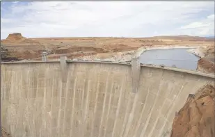  ?? CHASE STEVENS/LAS VEGAS REVIEW-JOURNAL ?? A view of Glen Canyon Dam and Lake Powell at the Glen Canyon National Recreation Area on Wednesday, July 28, 2021.
