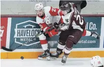  ?? CLIFFORD SKARSTEDT EXAMINER FILE PHOTO ?? Petes' Mason McTavish battles with Greyhounds' Jaden Peca on Jan. 30. McTavish is a potential first-round NHL draft pick.