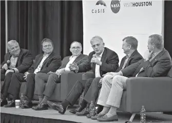  ?? Mark Mulligan/Houston Chronicle via AP ?? Dave Wolf, center, who made four space flights, speaks as part of a panel of astronauts who have made the transition to the business world during the third annual Space Commerce Conference and Exposition, SpaceCom, Thursday in Houston.