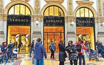  ?? AFP ?? Italian fashion house Versace in the Vittorio Emanuele II Gallery in Milan. Versace, known for its bold and glamorous designs, becomes the latest Italian brand to fall into foreign hands.