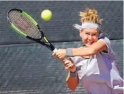  ?? JIM THOMPSON/JOURNAL ?? Marie Bouzkova hits a backhand to Tara Moore in Coleman Vision Tennis Championsh­ips action on Tuesday. Bouzkova, the fifth seed in singles, fell in straight sets.