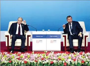  ?? WANG ZHAO/AFP ?? Russia’s President Vladimir Putin and Oleg Deripaska (right), CEO of UC Rusal, take part in the APEC CEO Summit at the China National Convention Centre in Beijing on November 10, 2014.